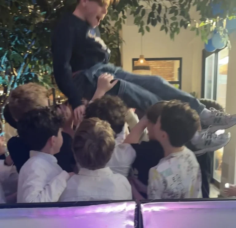 Guests dancing under event lighting