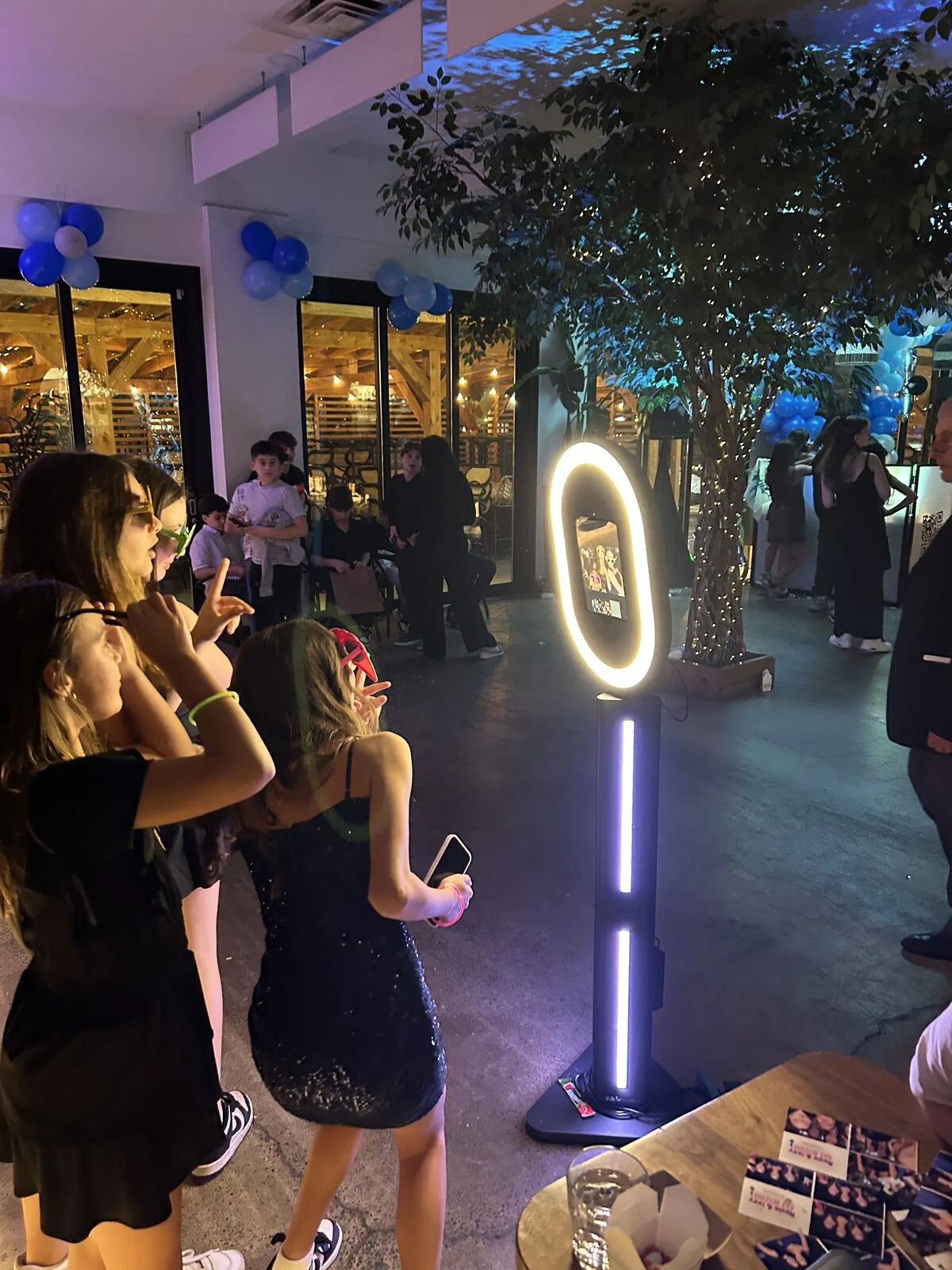 Guests using the digital iPad photobooth at an event